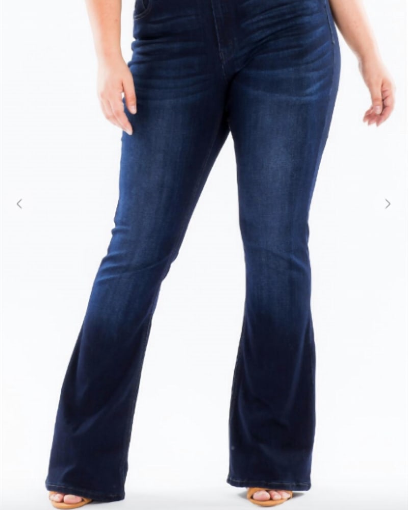 Front of a model wearing a size XL Mid Rise Flare Jeans In Blue in Blue by KanCan. | dia_product_style_image_id:358408